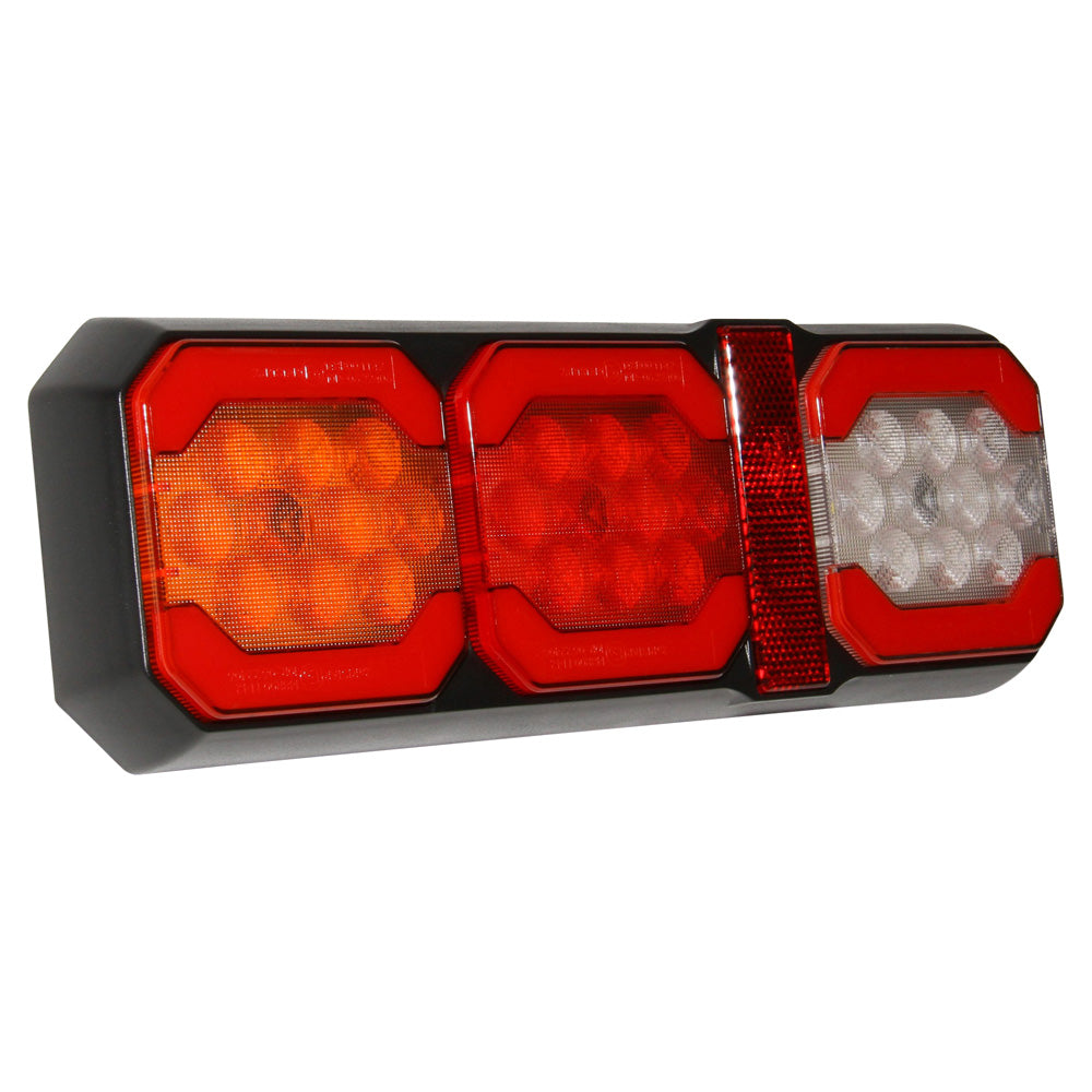 LED Tail Combination Lamp 10-30V-NIC-TL200. Side view of lamp with three lenses with a red reflector and black base.