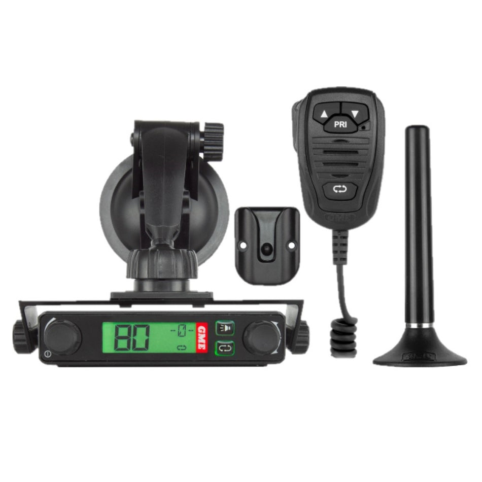 Compact Radio UHF CB 5 Watt-TX3120SPNP. Front view of Radio with microphone, microphone holder and magnetic antenna.